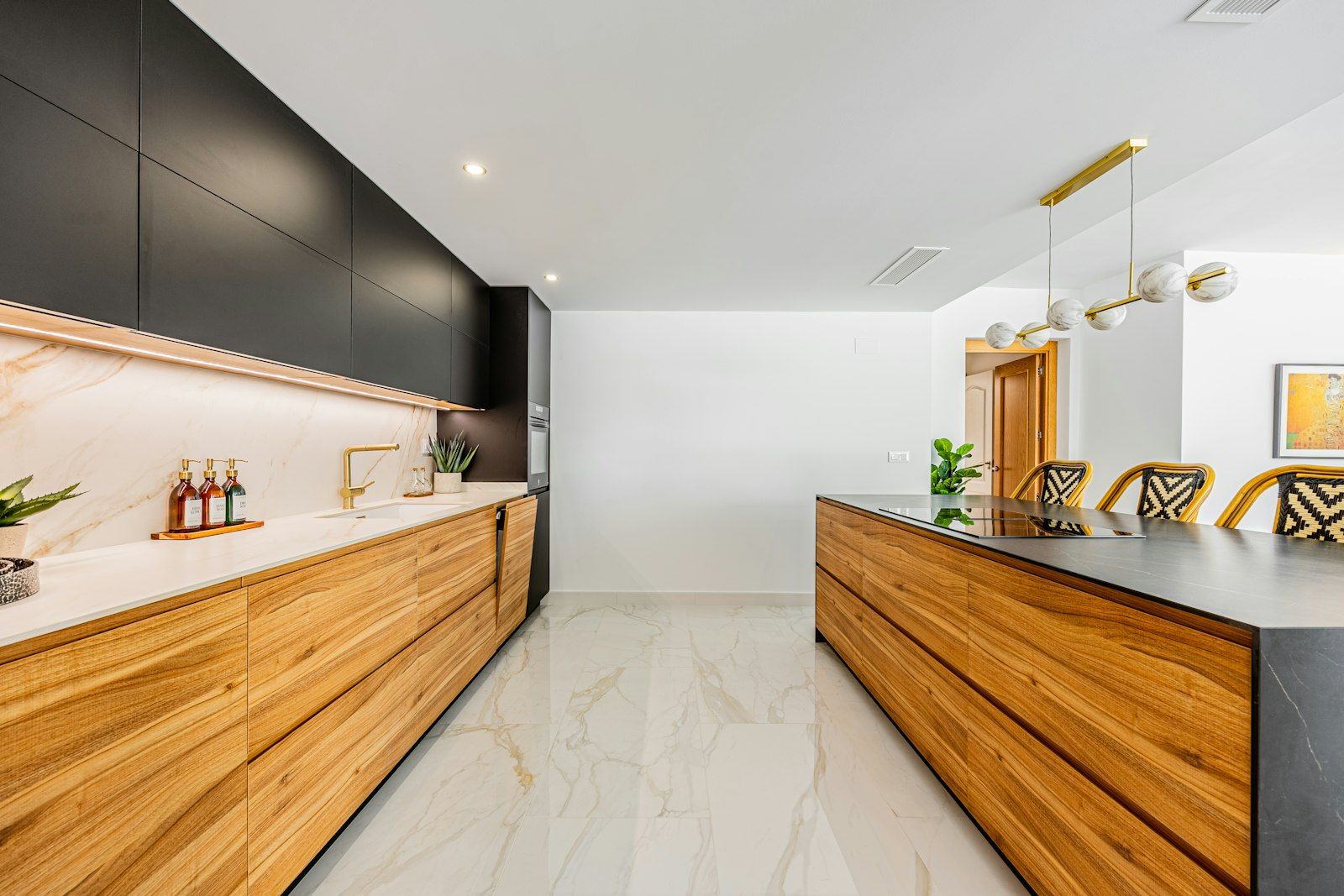 Custom kitchen renovation with warm wood cabinetry and a stone island