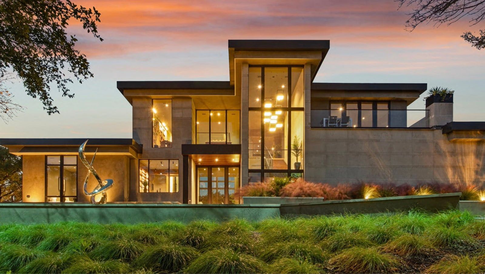 Modern estate-style custom home exterior at dusk, new construction